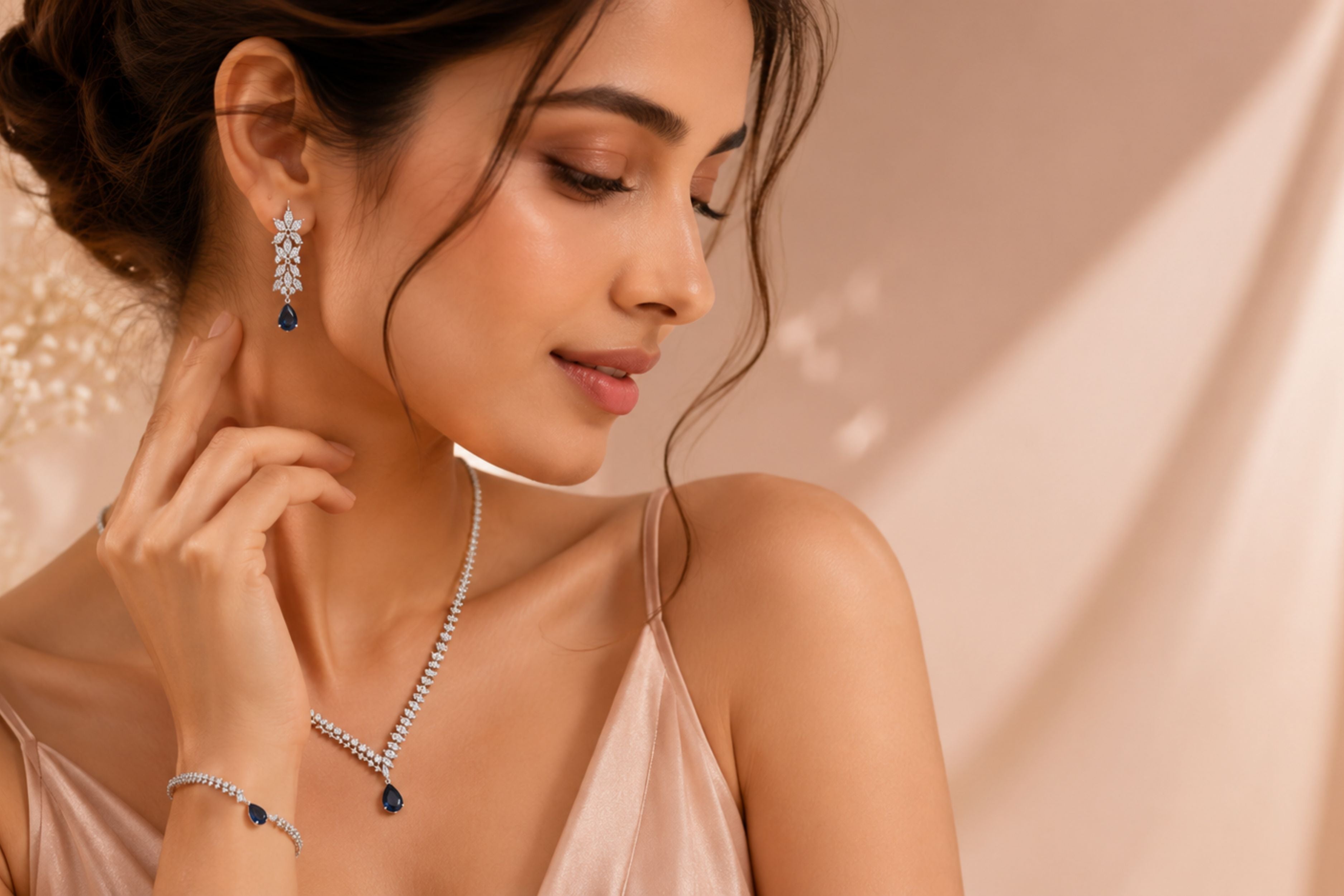Woman wearing diamond jewelry against a beige background